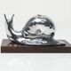 Silver snail candlestick on a teak base 1960