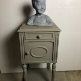 Child bust in grey patinated plaster