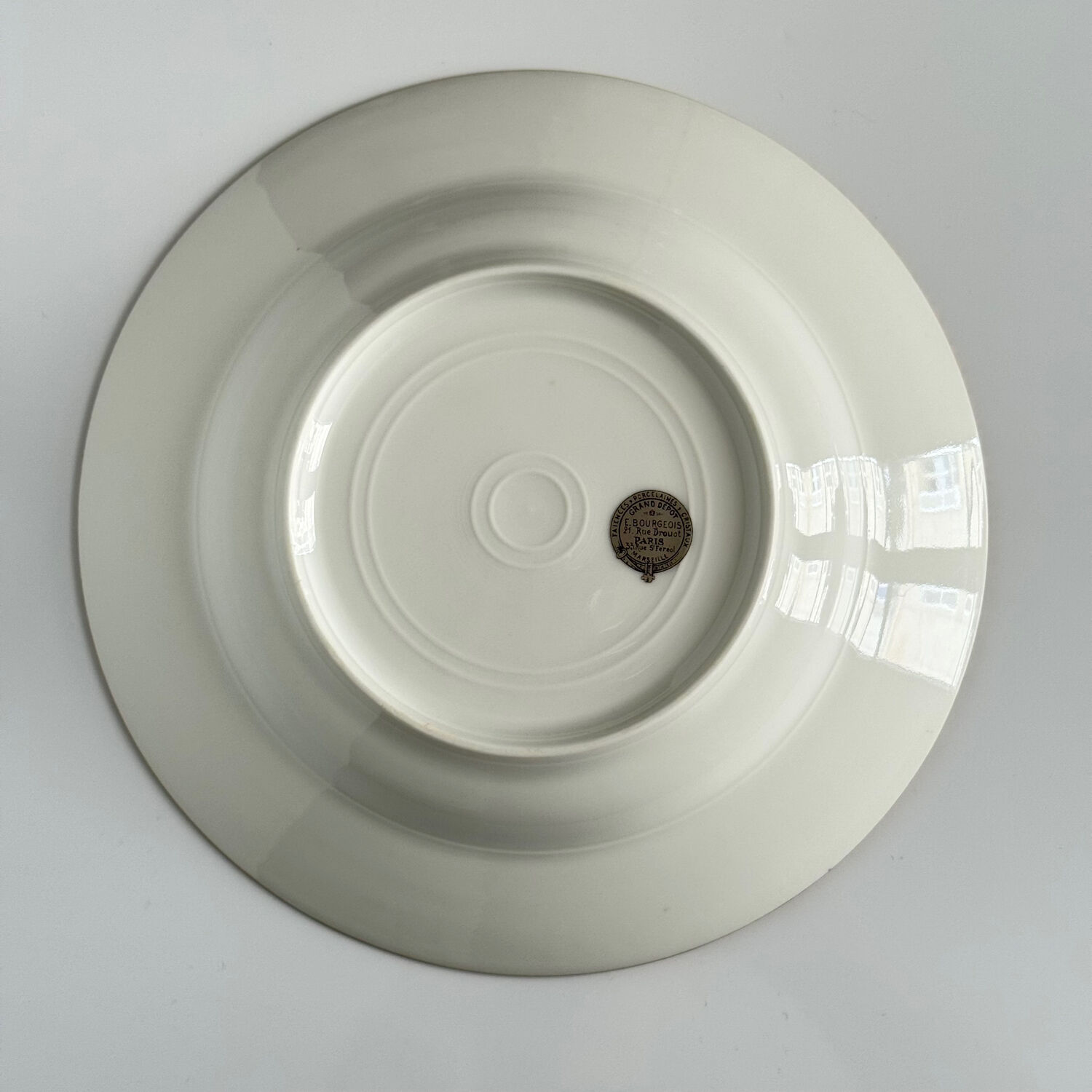 Set of monogrammed plates with gilt edges | E. Bourgeois | Late 19th century