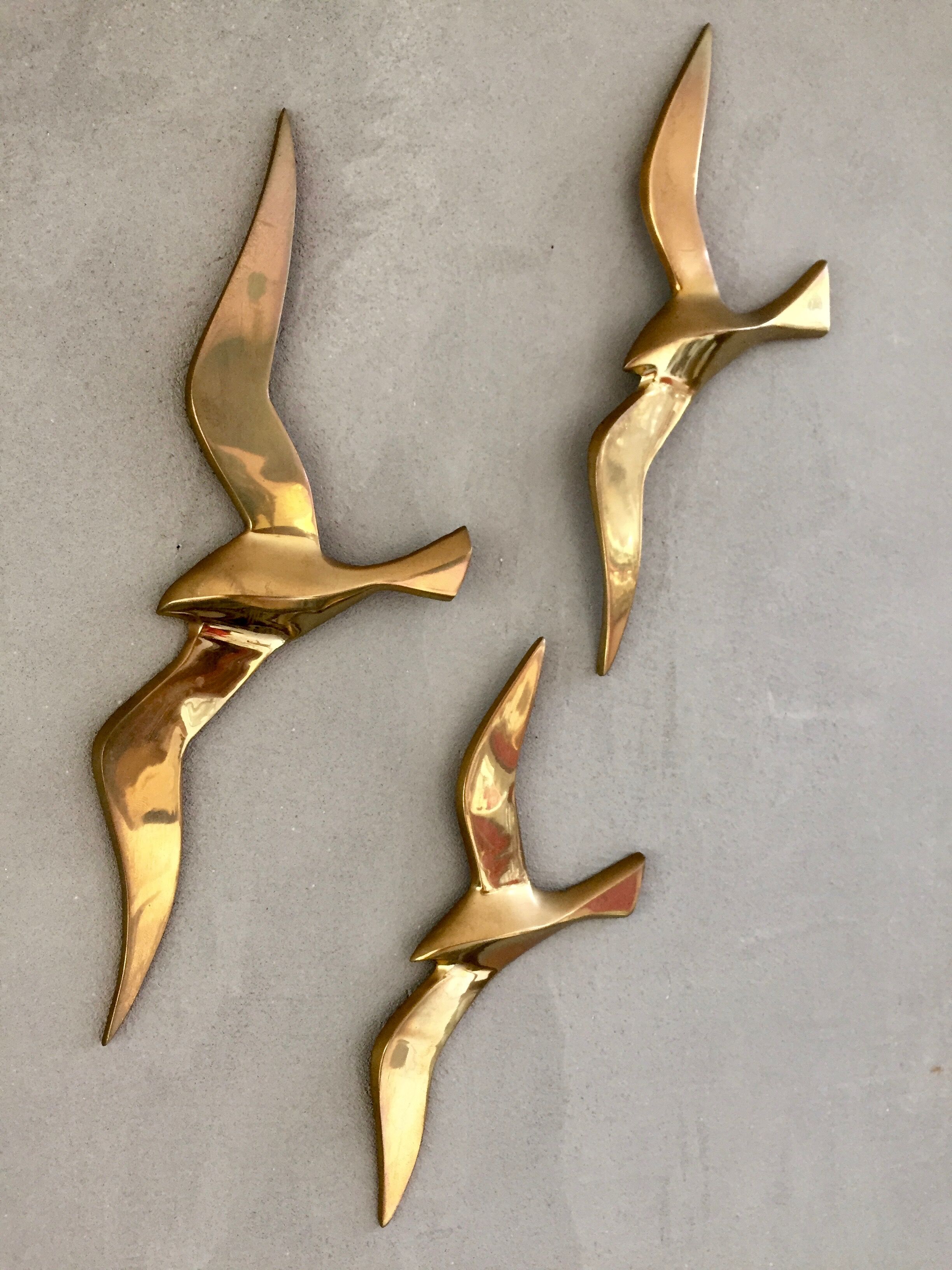Trio of brass birds