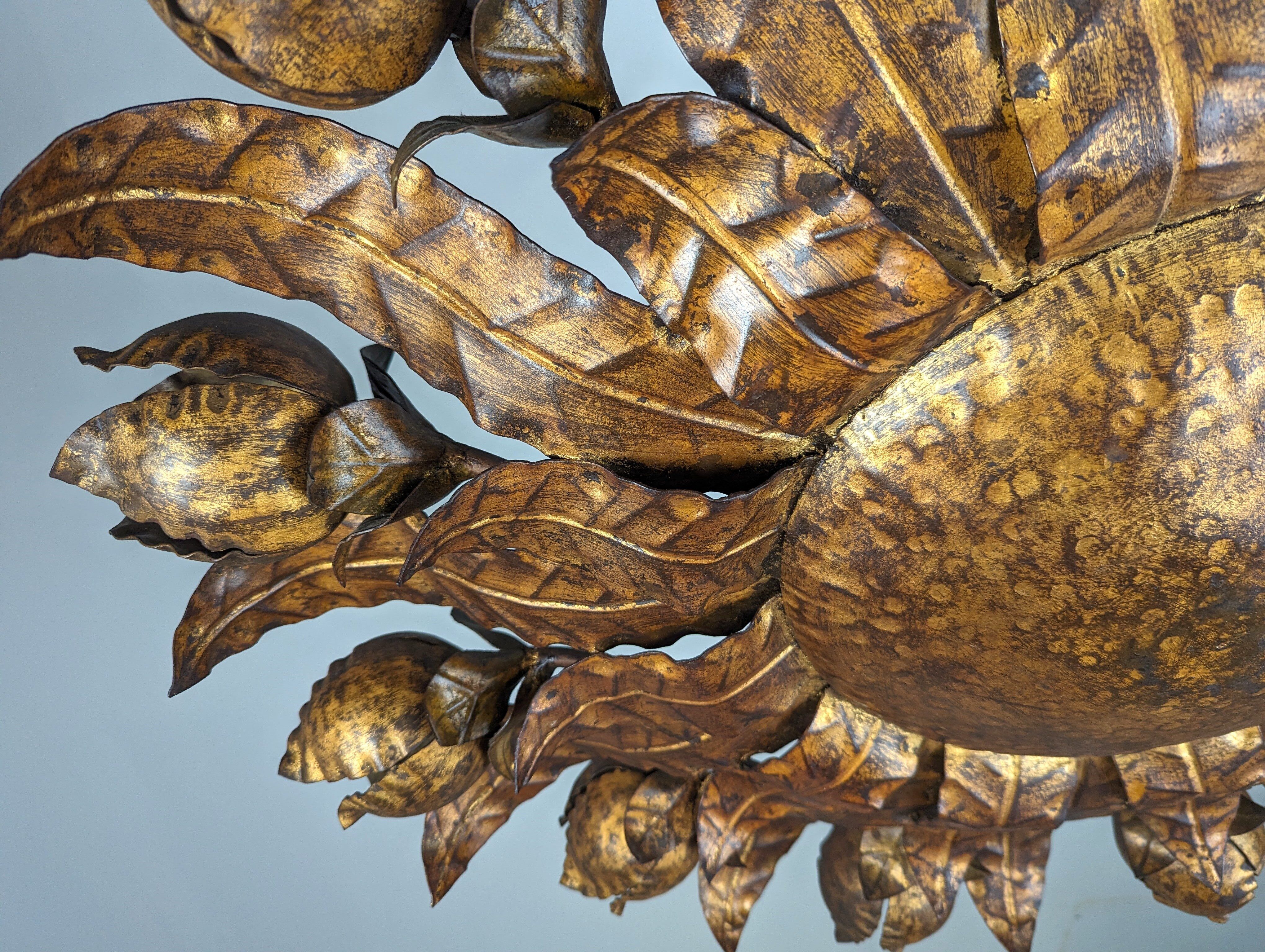 Large mid-century sunburst ceiling lamp, gilded metal with floral motif, 1950s