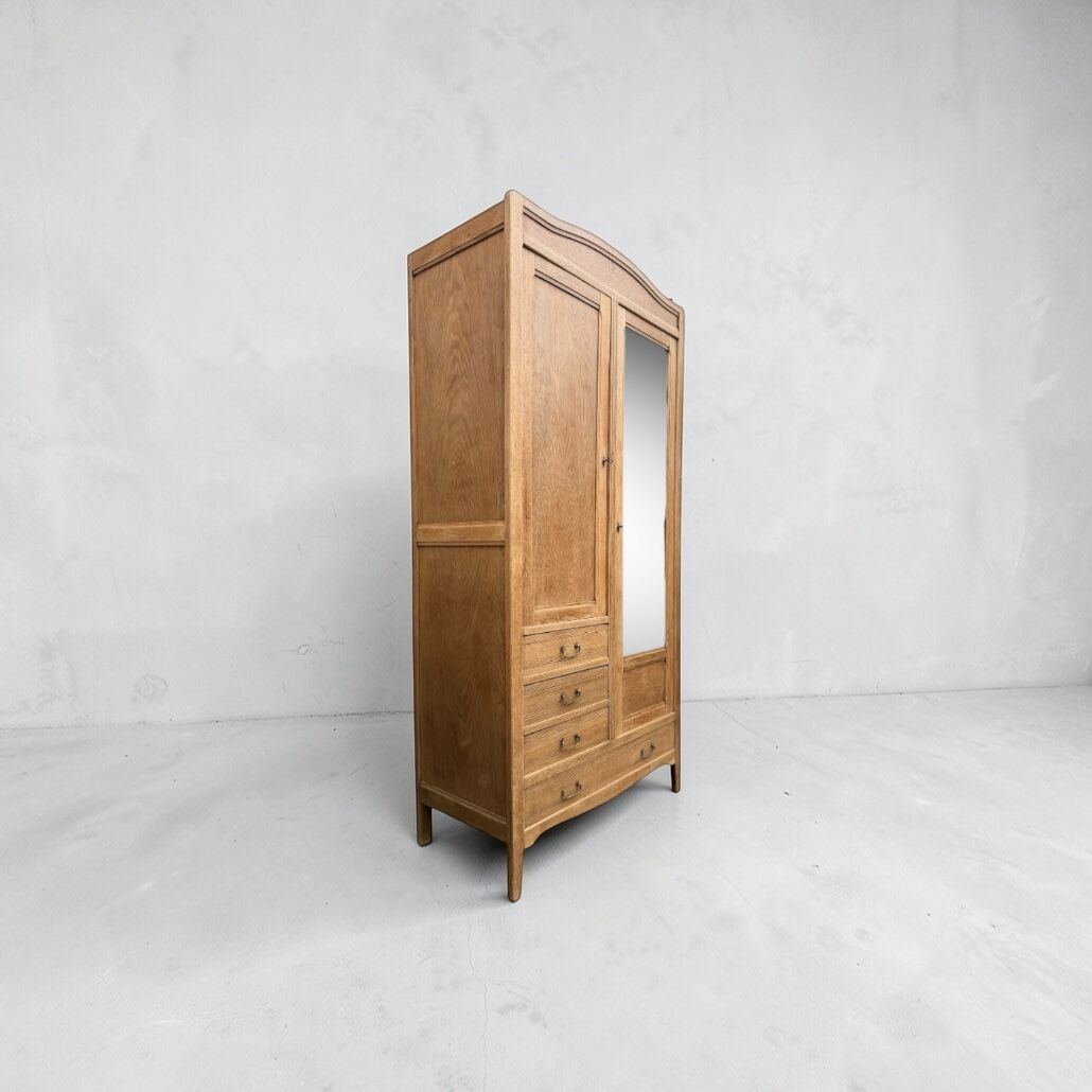 Parisian hotel wardrobe with bevelled mirror, solid raw oak, 1920.