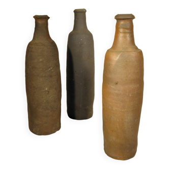 Three ancient norman stoneware bottles