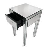 Bedside table covered with beveled mirrors on all sides