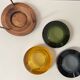 Set of 3 stackable glass catchalls with a teak base.