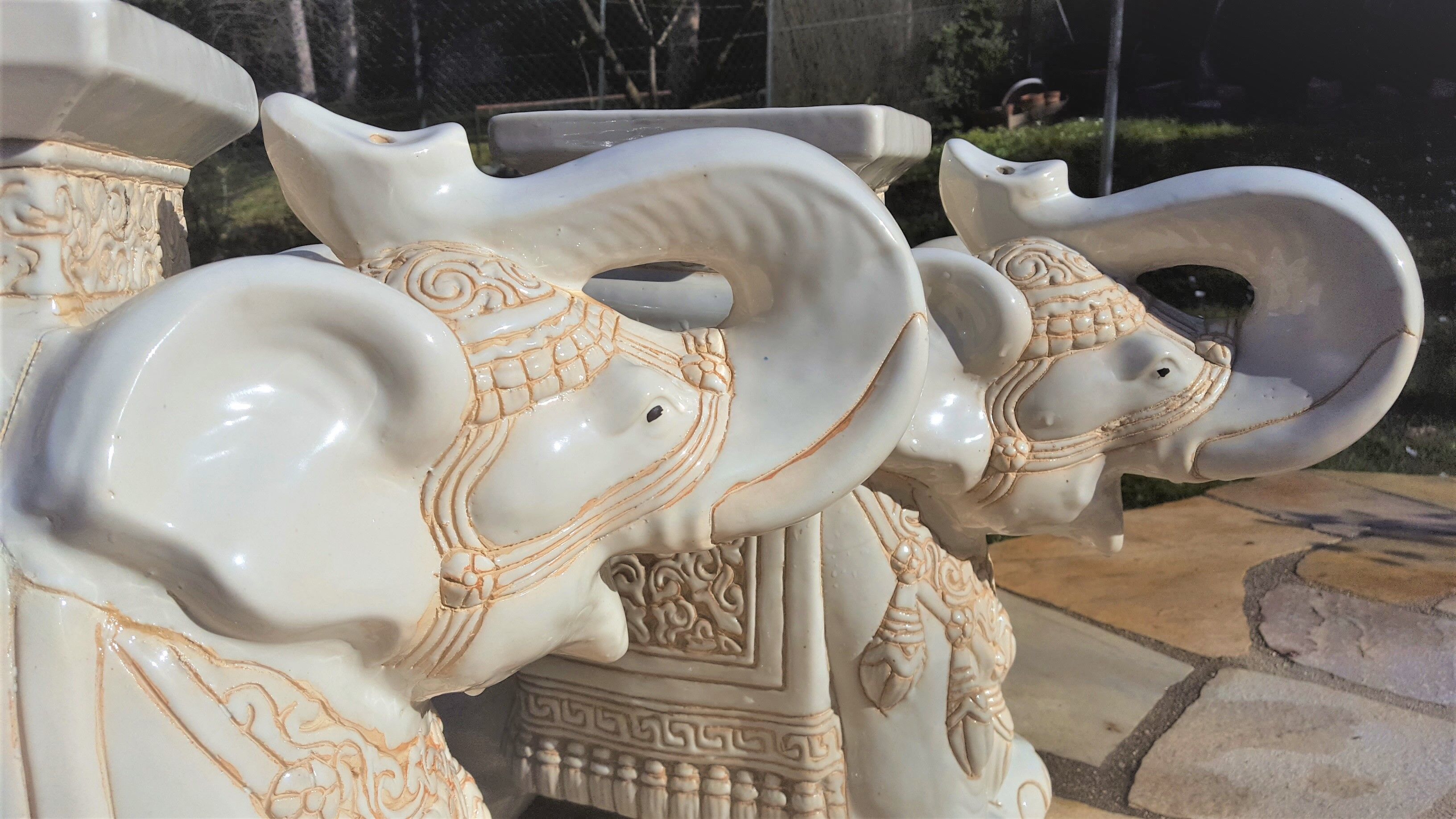 Pair of enamelled white ceramic elephant harnesses