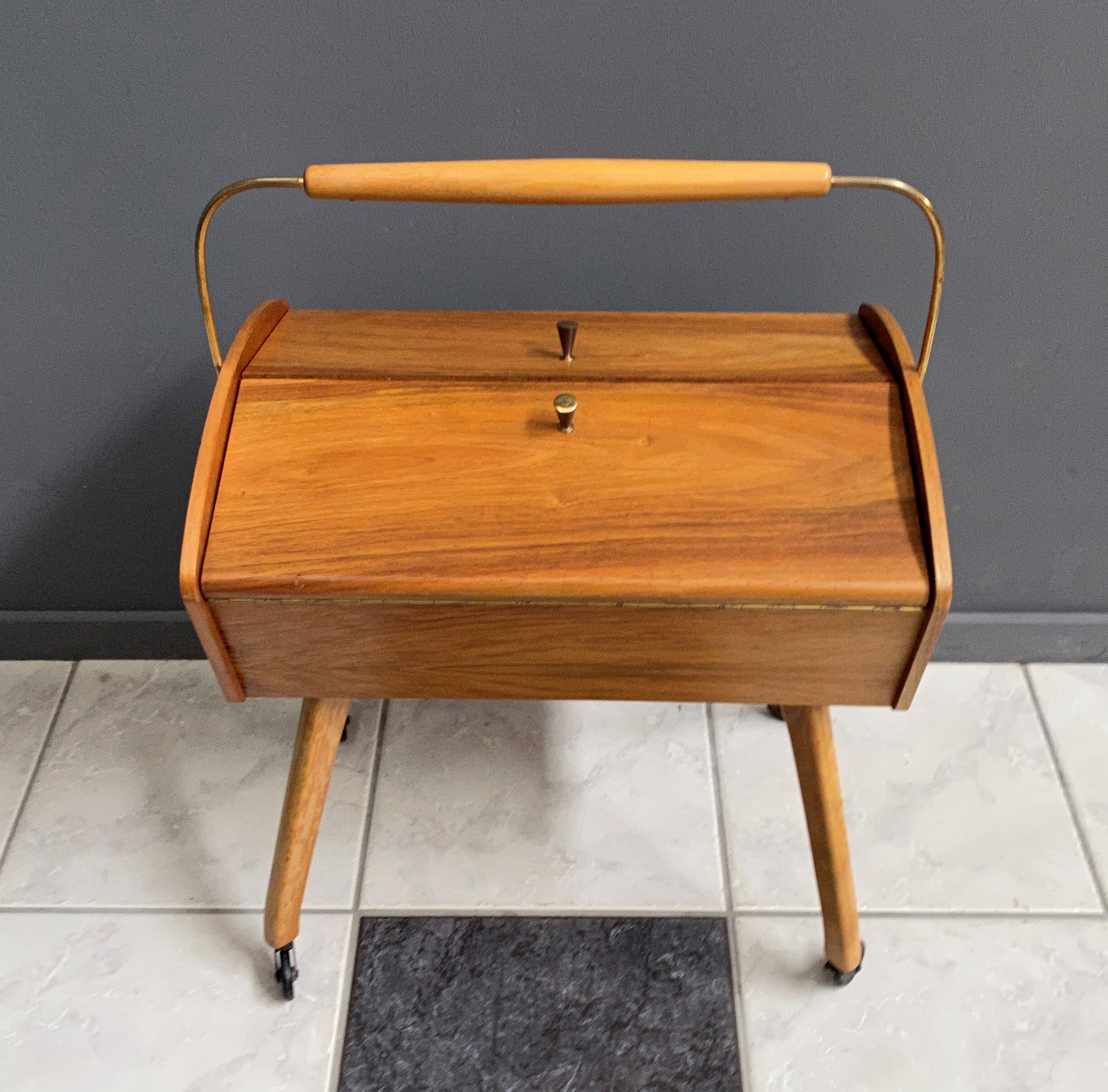 Sewing box on legs and wheels