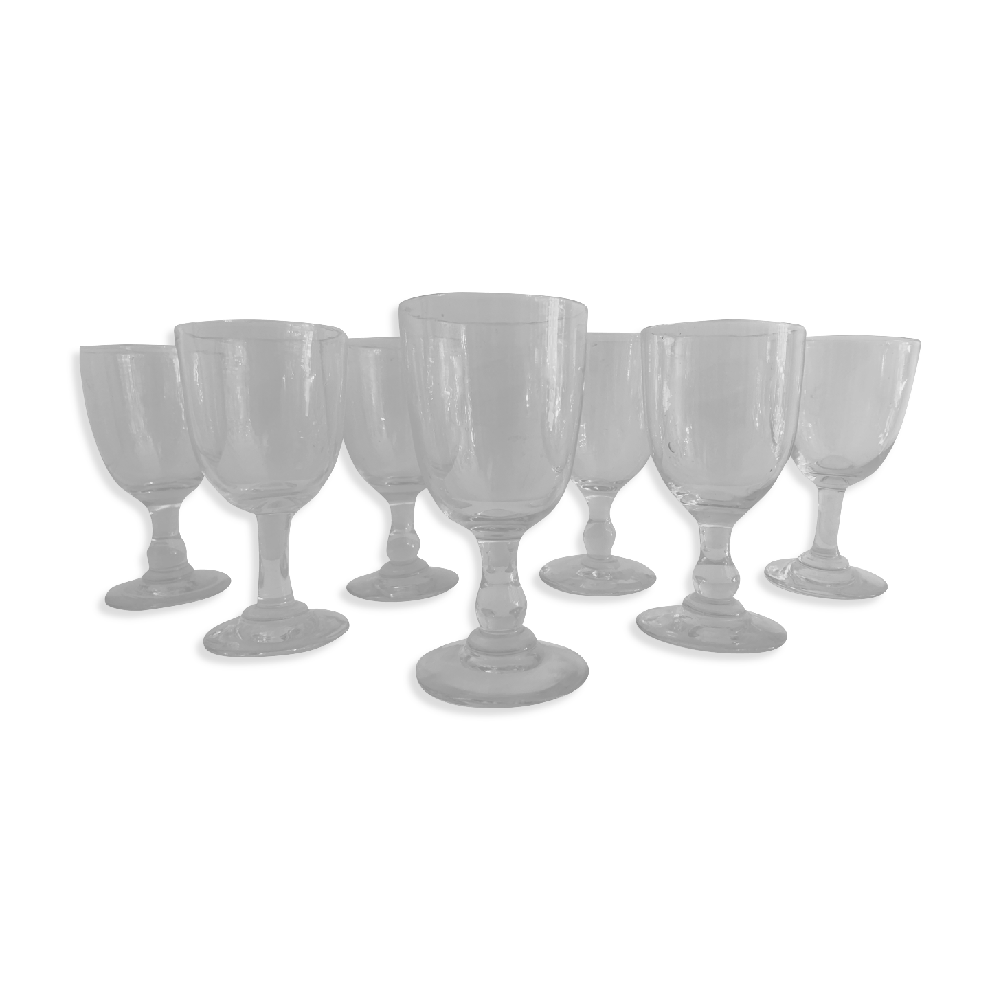 7 antique blown foot glasses