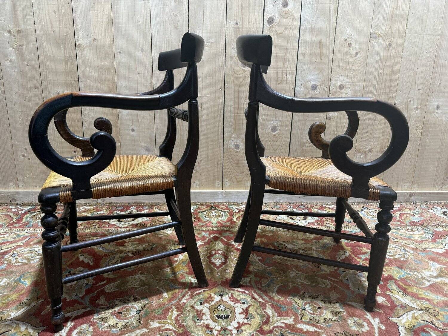 Pair of rustic straw-seated armchairs