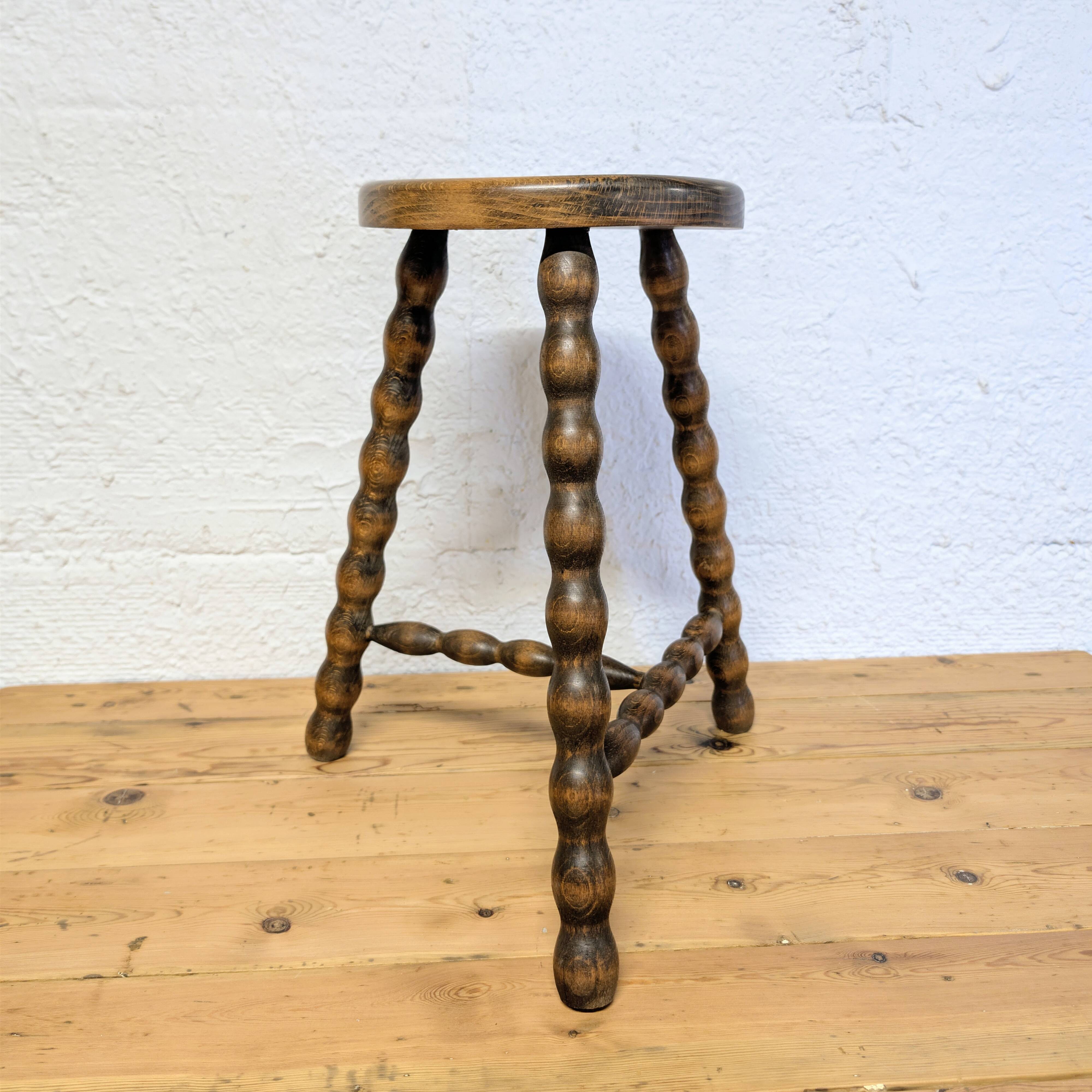 Turned wooden tripod stool