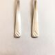 Set of 2 silver metal cutlery with punches