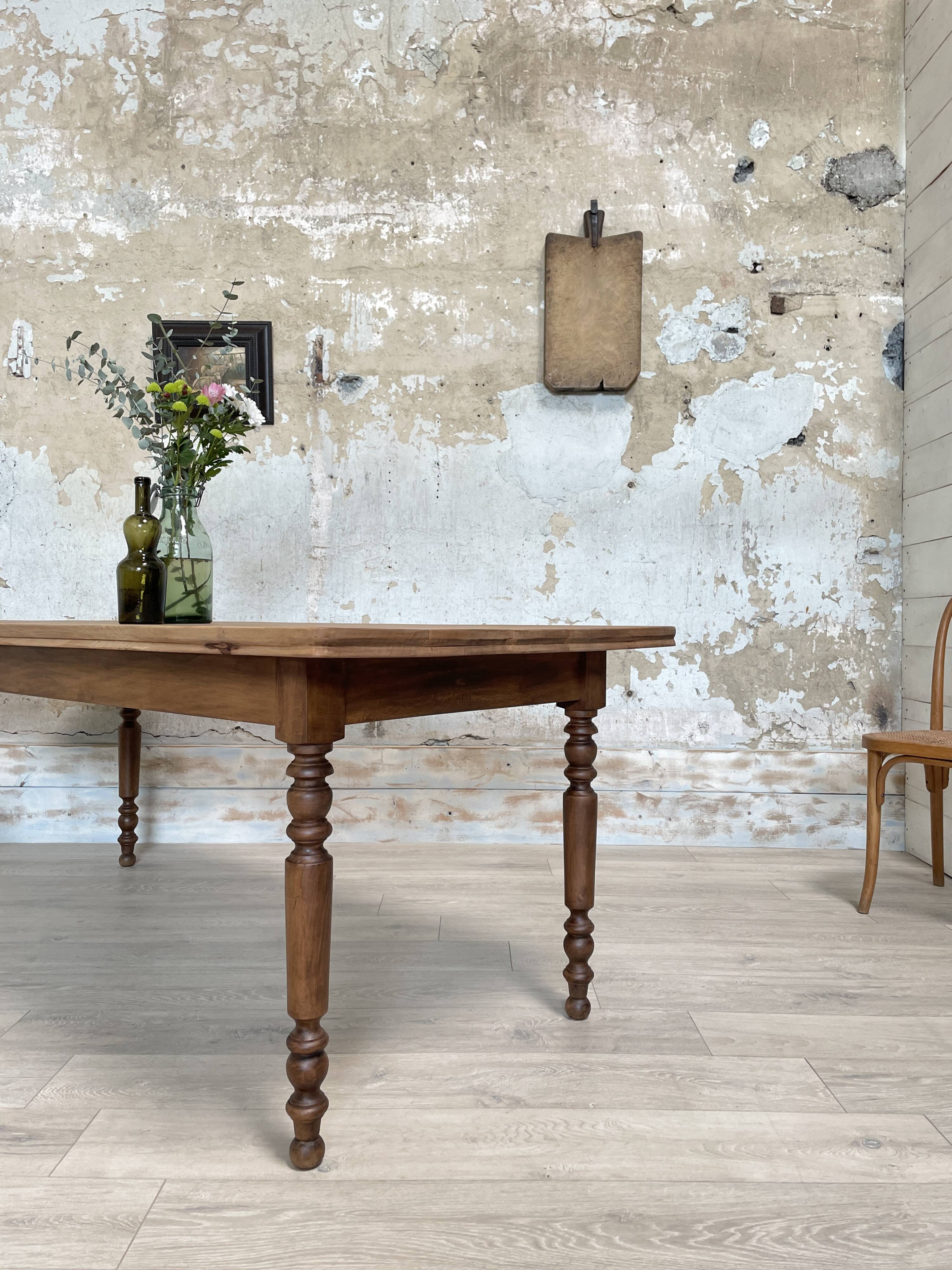 Vintage farmhouse table with turned legs.