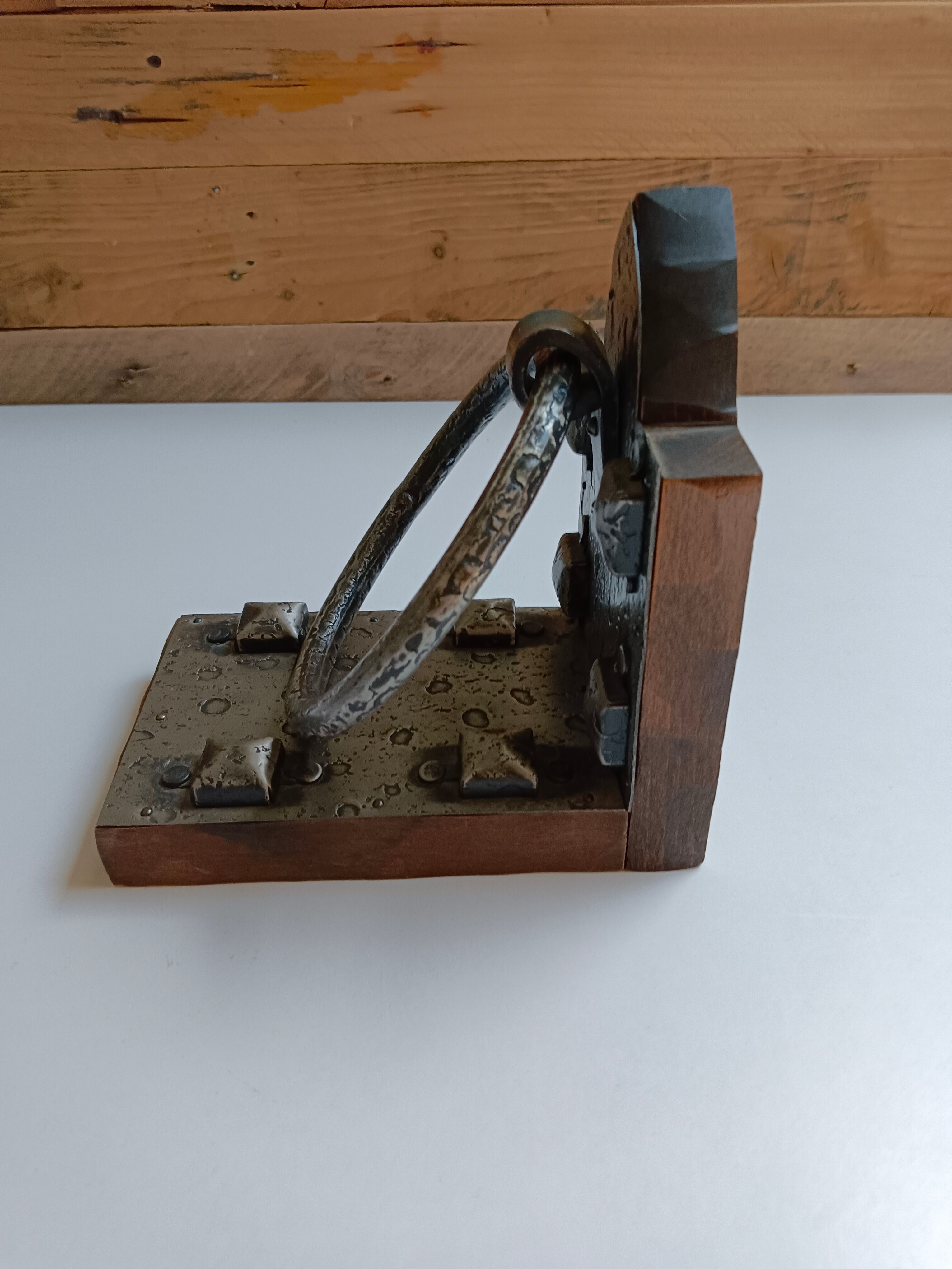 Medieval-style bookends, antique door handle.
