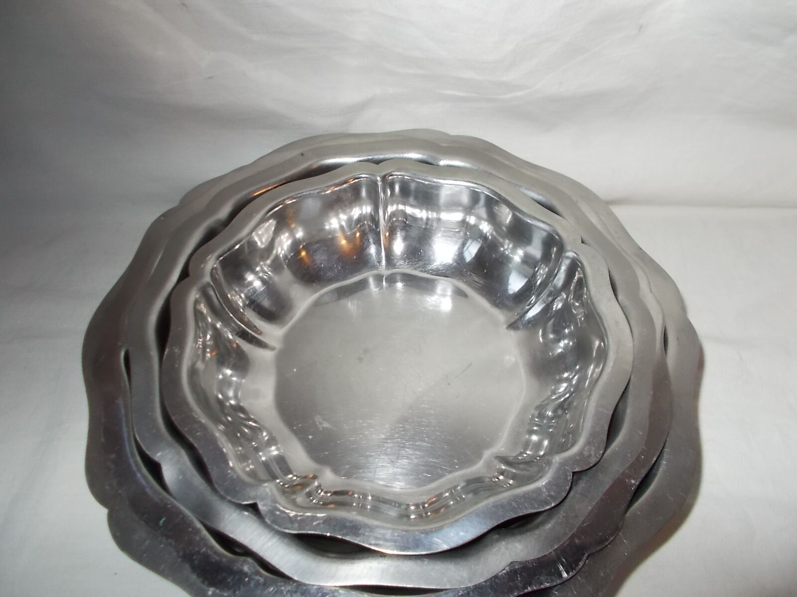 Lot of 4 round hollow stainless steel dishes