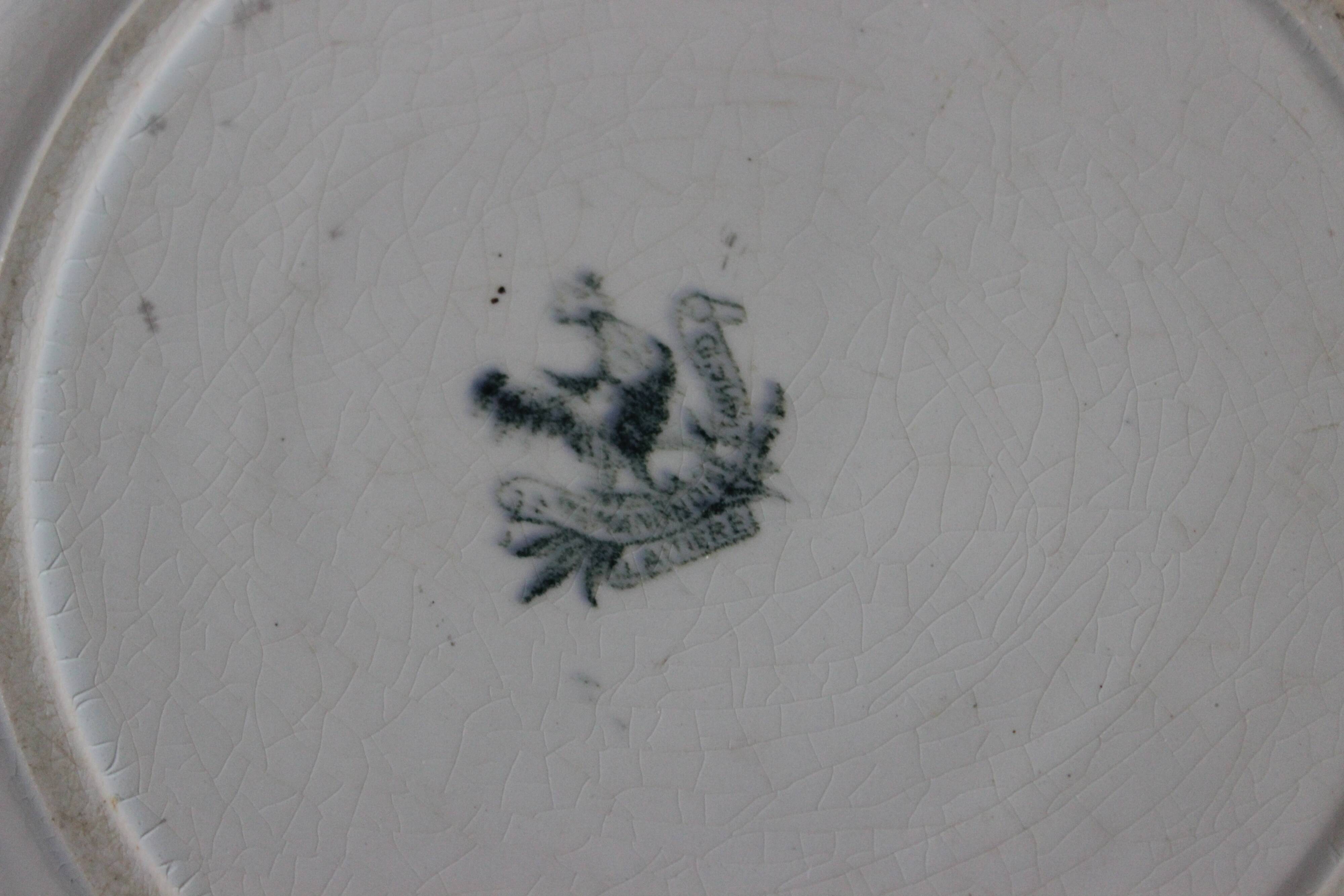 Round hollow dish, Iron earth, Saint Amand, milkmaid model, goat decoration