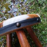 Antique tripod stool in wood and cowhide