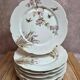 Set of 7 antique porcelain plates – Decorated with polychrome birds and flowers