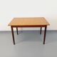 Rectangular dining table in vintage Scandinavian style made of teak and melamine.