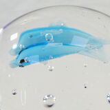 Sulphide / Paperweight THE DOLPHINS with a blue background