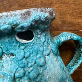 Strange ancient turquoise pitcher