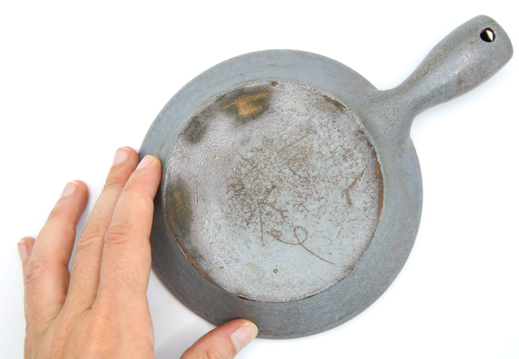 Poelon in grey sandstone like a pocket drain Le Triskel