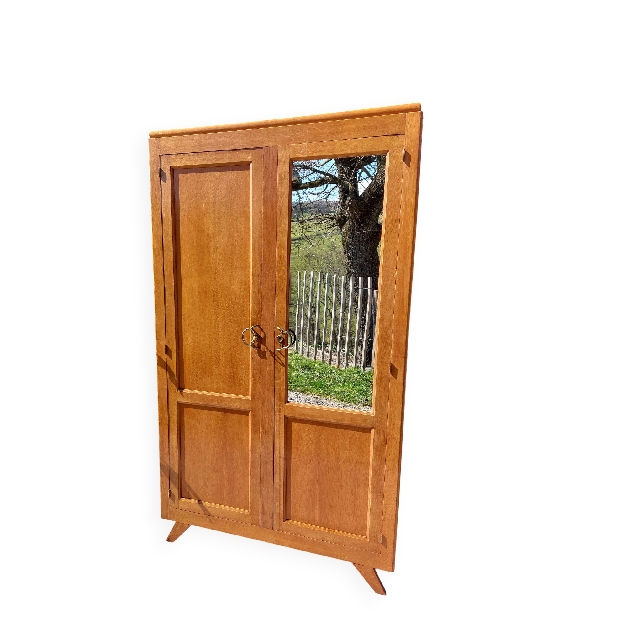 Vintage wardrobe with mirror and tapered legs.