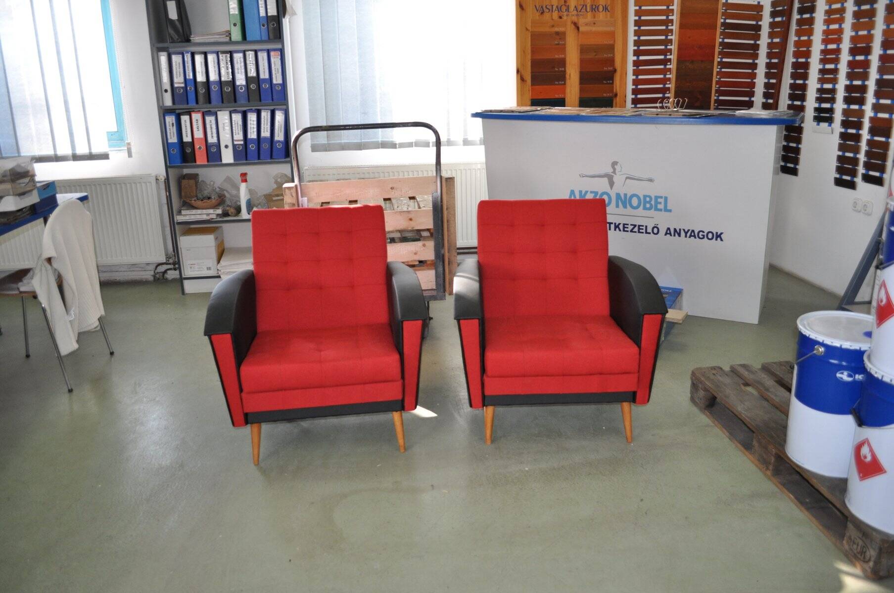 Pair of vintage red fabric armchairs with light wood legs from the 1960s.