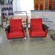 Pair of vintage red fabric armchairs with light wood legs from the 1960s.