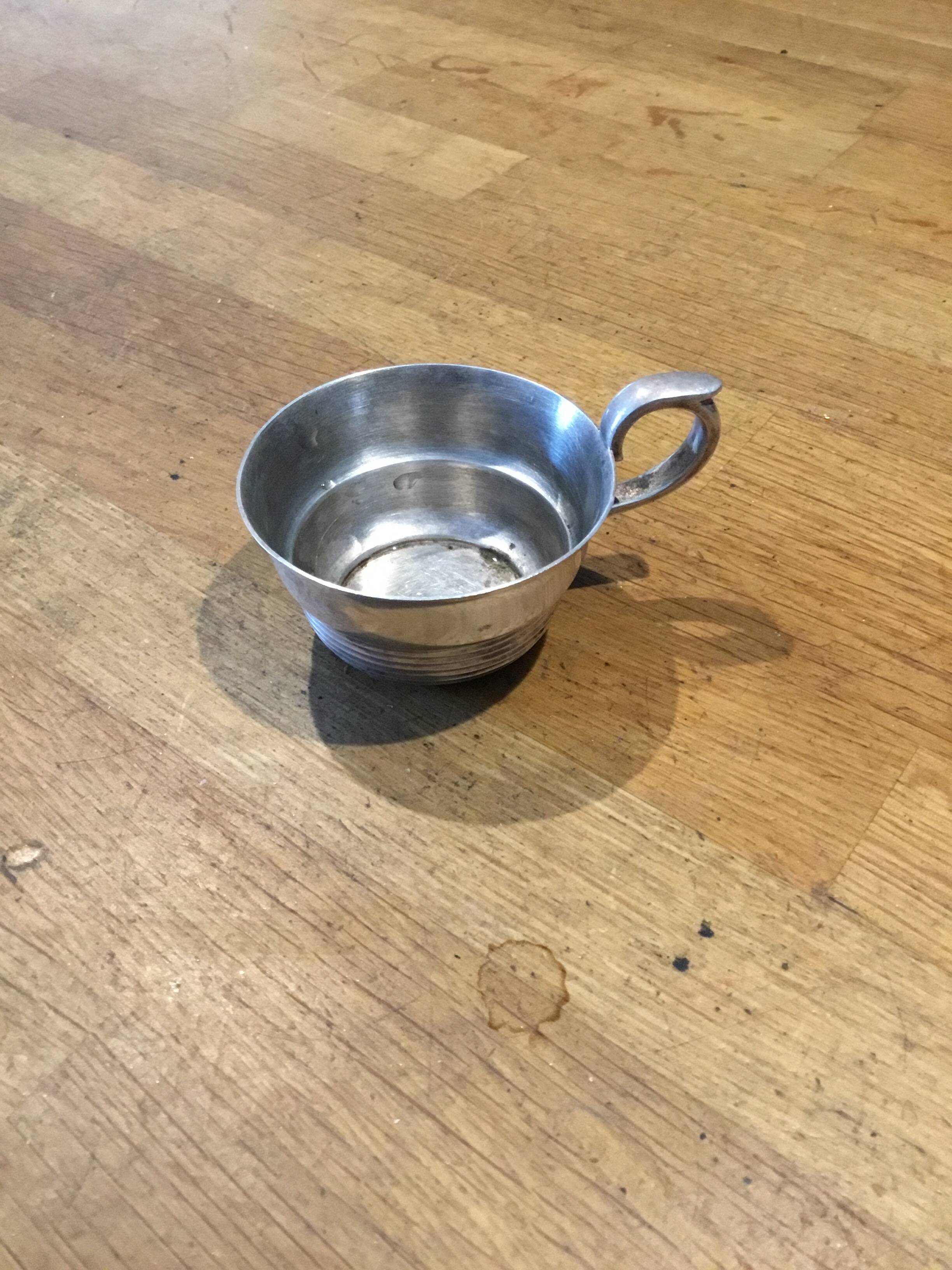 small silver-plated metal cup