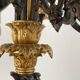 Candelabra with cherub in patinated bronze