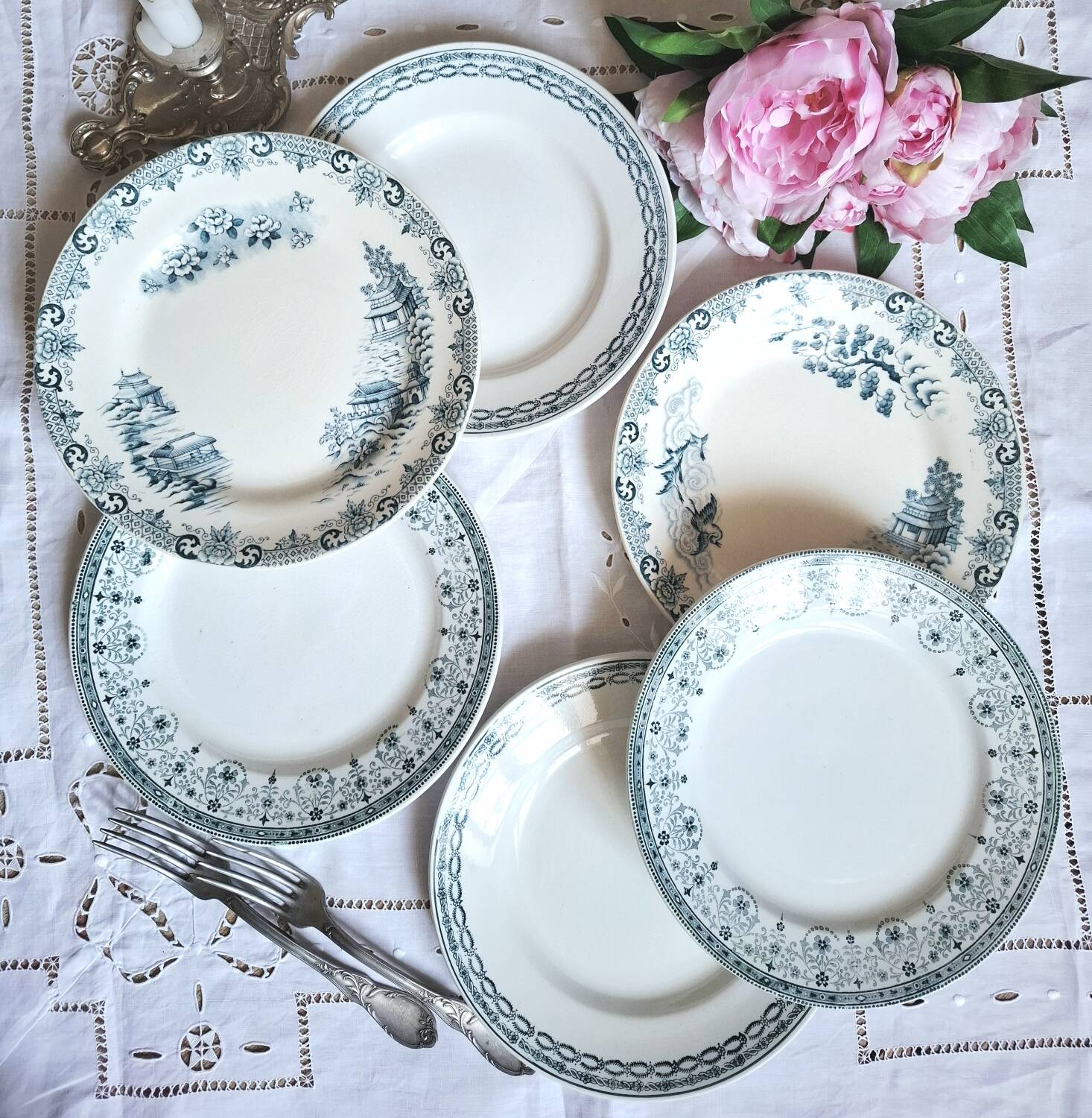 Mismatched antique flat plates made of ironstone accompanied by