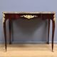 Rosewood, mahogany, and rosewood desk-table, Louis XV style – early 20th century.