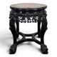 Side table with a wooden frame and marble top.