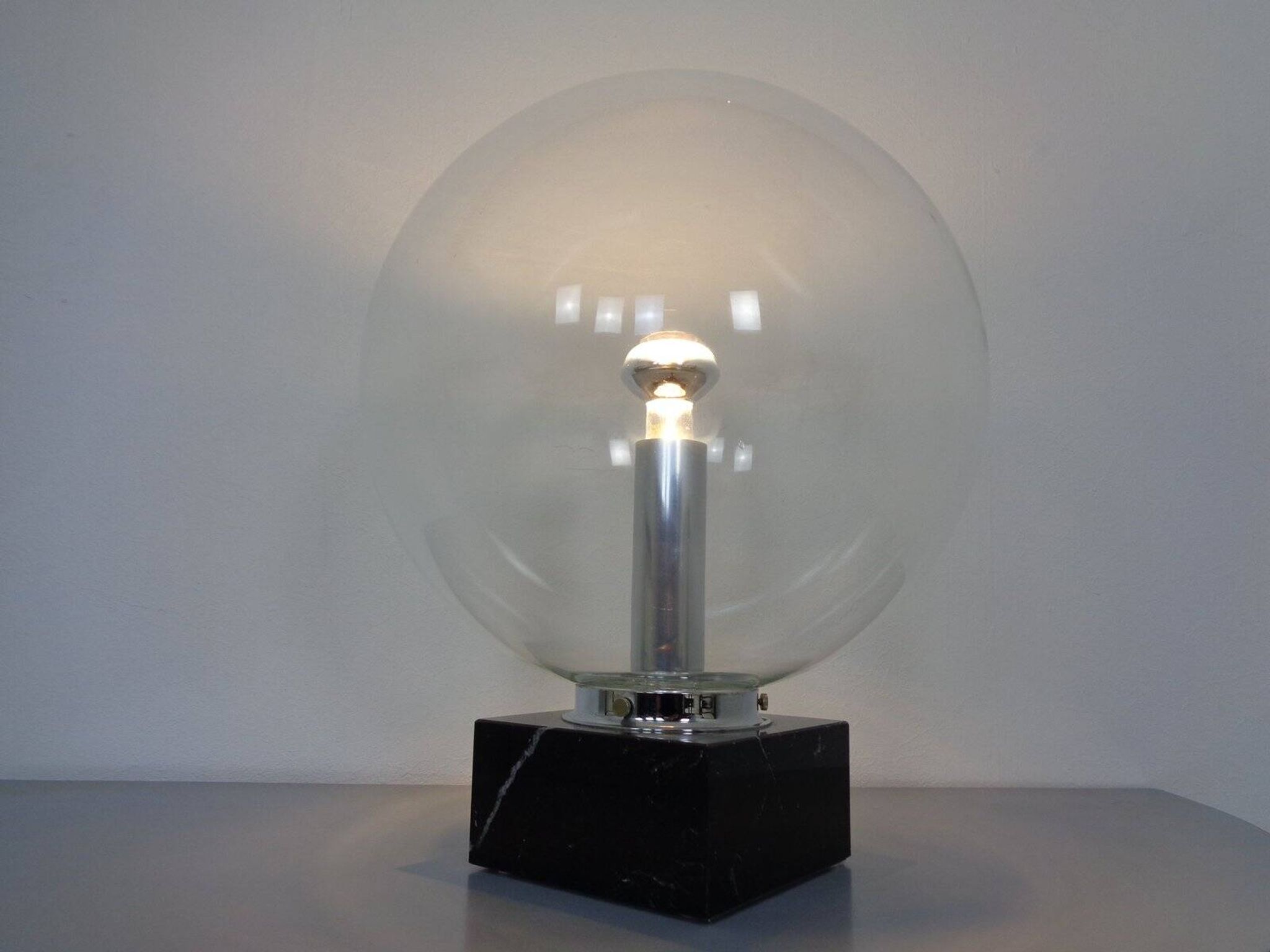 Large glass globe and marble table lamp from Erco, 1960s.