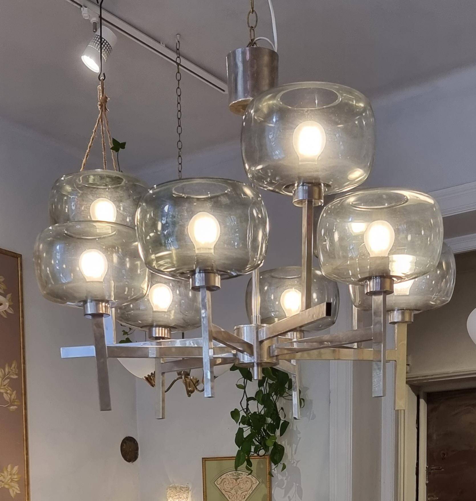 Timeless modern Scandinavian / mid-century chandelier in chrome and smoked glass.