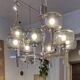 Timeless modern Scandinavian / mid-century chandelier in chrome and smoked glass.