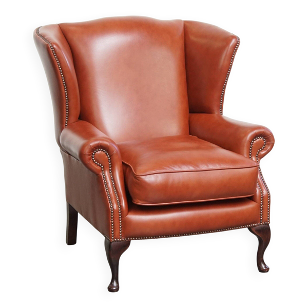 Fauteuil à oreilles Chesterfield en cuir de vachette lisse et élégant