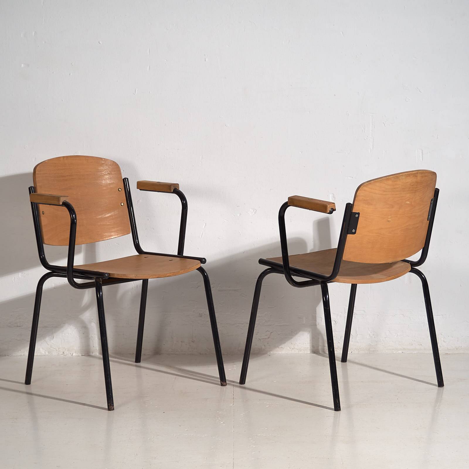 Industrial style chairs with armrests (circa 1950). Set of 2 pieces