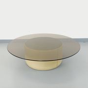 Vintage round coffee table in glass, leather, and metal in Space Age style from the 70s.