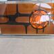 Metal and ceramic earthenware coffee table