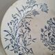 Set of 6 flat plates plus one earthenware dish.