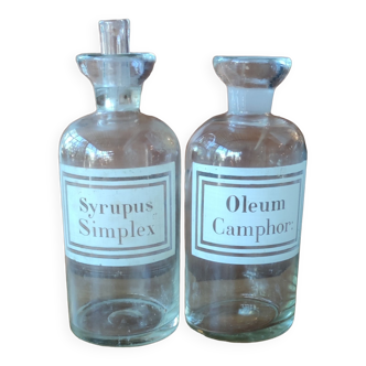 Two old Syrupus Simplex Oleum Camphor pharmacy bottles