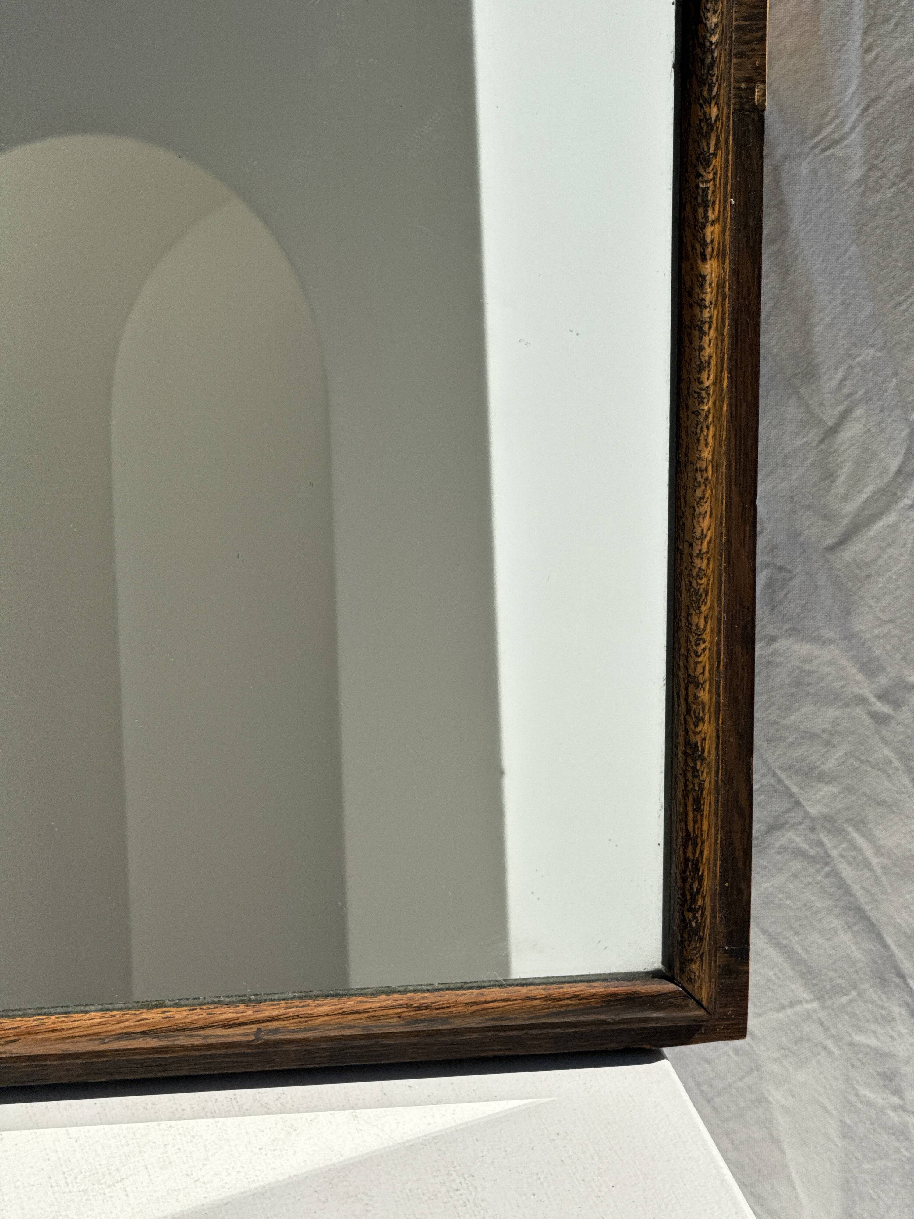 Small antique English rectangular mirror with pediment and oak frame