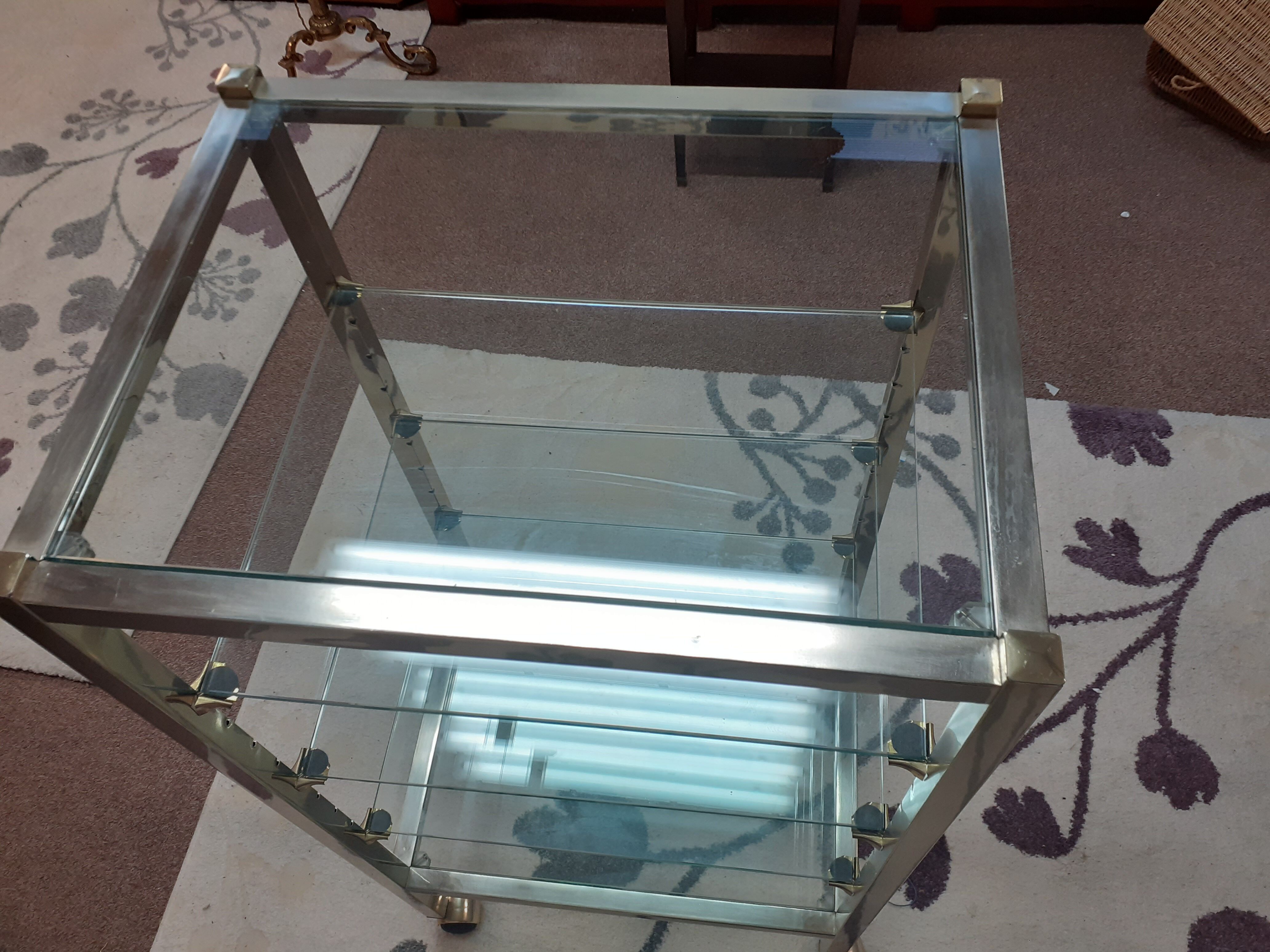 Glass and brass shelf on wheels