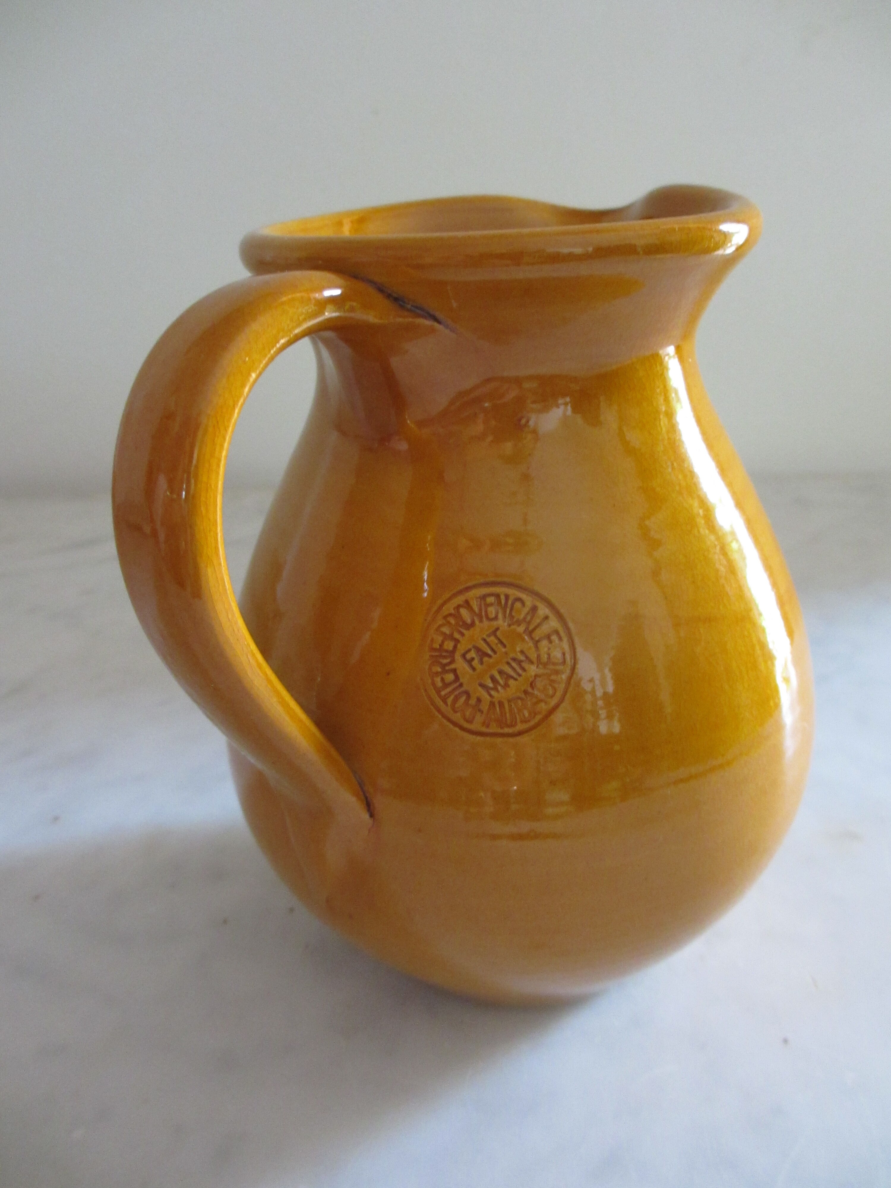 Enamelled earthenware pitcher