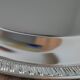 Silver-plated metal dish with a 1980s pattern