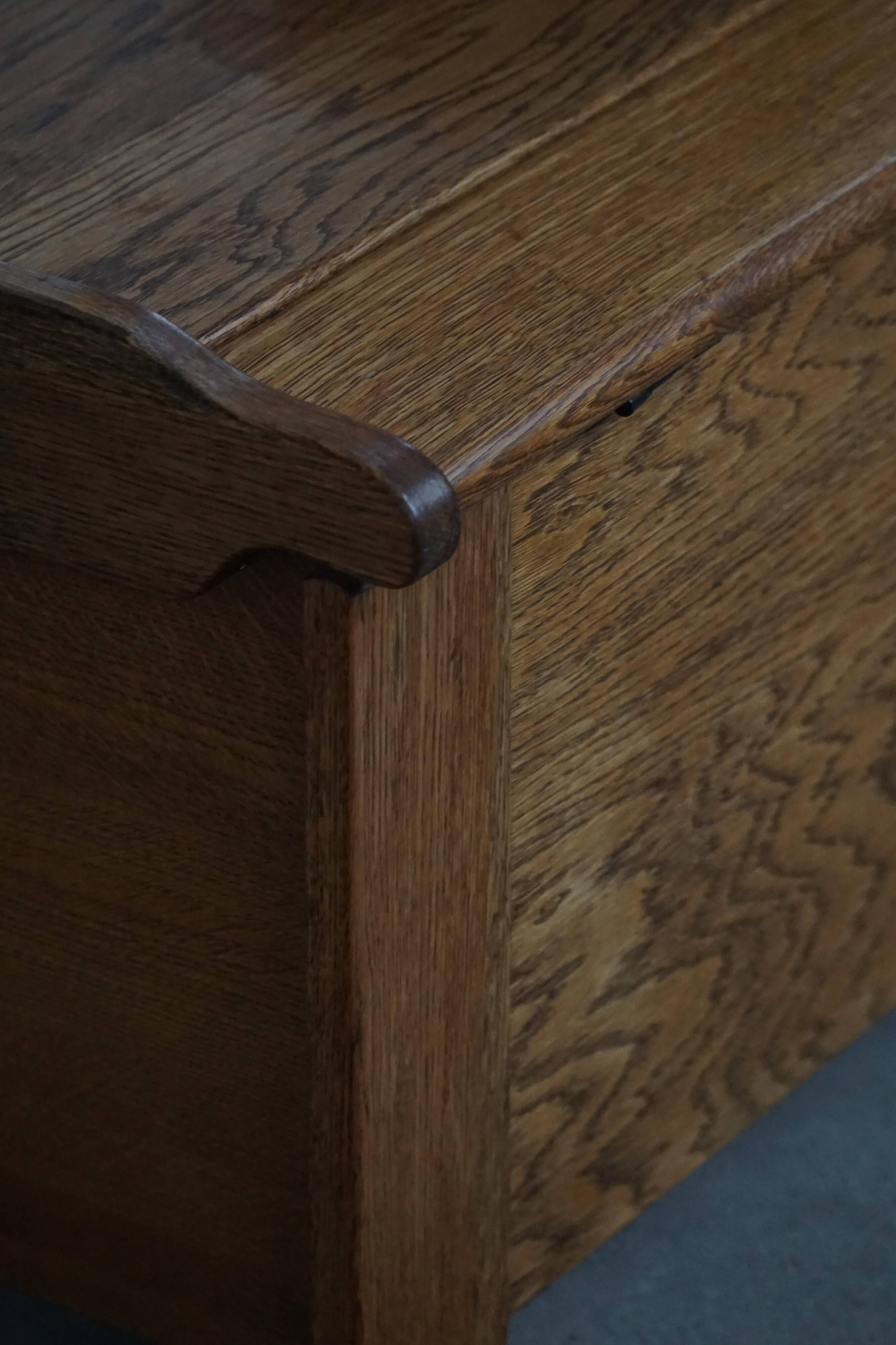 Modern Danish oak commode with decorative relief sculpture, mid-20th century.