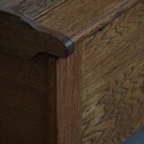 Modern Danish oak commode with decorative relief sculpture, mid-20th century.