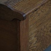 Modern Danish oak commode with decorative relief sculpture, mid-20th century.