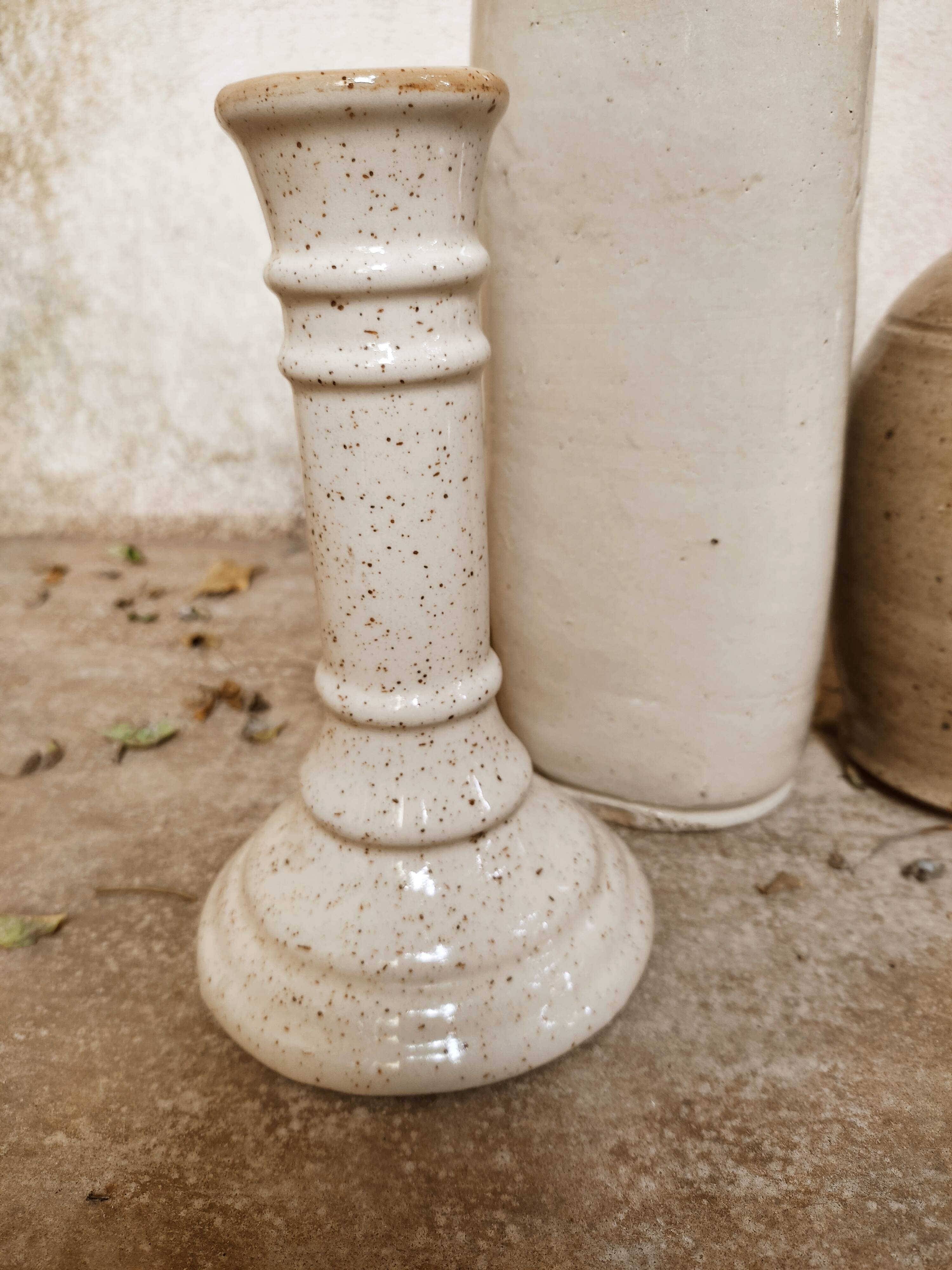 Stoneware decanters and candle holder